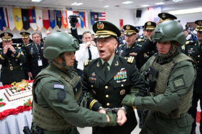 Handcuffed at His Own Victory Party: Decorated U.S. General Exposed as Military’s Biggest Thief – And His Most Hated Subordinate Just Took His Throne
